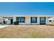 Exterior view of a single-story house with a yellow door at 475 Circlewood Dr # O18, Venice, FL 34293