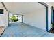 View of a carport with concrete flooring at 475 Circlewood Dr # O18, Venice, FL 34293