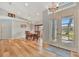 Bright dining room features a wood table, six chairs, and a large bay window at 5832 Garfield Rd, Venice, FL 34293