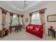 Home office featuring a red couch and built-in desk at 117 Savona Way, North Venice, FL 34275