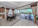 Casual dining area with sliding glass doors leading to the pool area at 117 Savona Way, North Venice, FL 34275