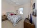 Bedroom with a double bed, nightstands, and window at 117 Savona Way, North Venice, FL 34275