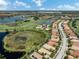 Aerial view of a luxury home in a golf course community at 117 Savona Way, North Venice, FL 34275