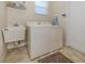 Laundry room with washer, dryer and utility sink at 117 Savona Way, North Venice, FL 34275