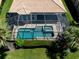Aerial view showing house, pool, and landscaping at 117 Savona Way, North Venice, FL 34275