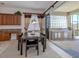 Bright kitchen with granite countertops, wood cabinets, and island at 117 Savona Way, North Venice, FL 34275