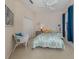 Bright bedroom with a queen-size bed and decorative pillows at 117 Savona Way, North Venice, FL 34275