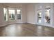 Gathering room with pool view, wood-look floors, and sliding doors at 145 Montelluna Dr, North Venice, FL 34275