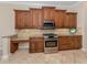 Kitchen with granite countertops and wood cabinets at 145 Montelluna Dr, North Venice, FL 34275