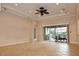 Living room, pool view, sliding doors and fan at 145 Montelluna Dr, North Venice, FL 34275