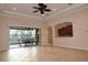 Spacious living room with sliding doors to patio at 145 Montelluna Dr, North Venice, FL 34275