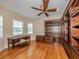 Spacious office with large built-in shelving and hardwood floors at 145 Montelluna Dr, North Venice, FL 34275