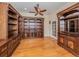 Home office with built-in bookcases and wood flooring at 145 Montelluna Dr, North Venice, FL 34275