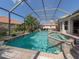 Resort-style pool with spa and screened enclosure at 145 Montelluna Dr, North Venice, FL 34275