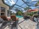 Relaxing patio with pool, spa, and comfortable seating at 145 Montelluna Dr, North Venice, FL 34275