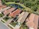 Aerial view showcases property layout, landscaping, and proximity to water and golf course at 277 Mestre Pl, North Venice, FL 34275