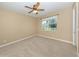 Bedroom with carpet, neutral paint, a ceiling fan, and a window view of the backyard at 277 Mestre Pl, North Venice, FL 34275