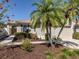 Charming one-story home with lush landscaping, tile roof, and attached garage; great curb appeal at 277 Mestre Pl, North Venice, FL 34275