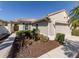 A well-maintained single-story home boasting a two-car garage, tile roof, and beautifully landscaped front yard at 277 Mestre Pl, North Venice, FL 34275