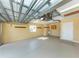Spacious garage featuring a durable epoxy floor, sink, and plenty of room for storage and parking at 277 Mestre Pl, North Venice, FL 34275