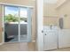 Laundry room featuring washer and dryer with view to the backyard at 277 Mestre Pl, North Venice, FL 34275