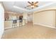 Open concept living room features tile floors, breakfast bar, and neutral paint at 277 Mestre Pl, North Venice, FL 34275