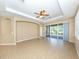 Open concept living area with tile floors and access to the screened lanai at 277 Mestre Pl, North Venice, FL 34275