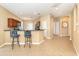 The living room features an open floor plan, tile floors, and bar seating at 277 Mestre Pl, North Venice, FL 34275