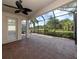 Large screened patio offers a serene view of the backyard, landscaping, and neighborhood at 277 Mestre Pl, North Venice, FL 34275