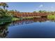 Metal footbridge crossing a tranquil waterway at 3588 Erie Ct, North Port, FL 34287