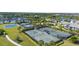 Aerial view of the community tennis courts, basketball court, and surrounding landscape at 8209 Redonda Loop, Lakewood Ranch, FL 34202