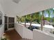 Condo entryway with screen door and view of parking at 760 Village Cir # 212, Venice, FL 34292