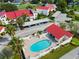 Community pool with surrounding patio furniture at 760 Village Cir # 212, Venice, FL 34292