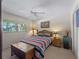 Bedroom with full-size bed and decorative dresser at 760 Village Cir # 212, Venice, FL 34292