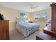 Main bedroom with a queen-size bed and ample closet space at 760 Village Cir # 212, Venice, FL 34292