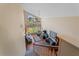 Upstairs view of spacious living room with cathedral ceilings and large windows at 760 Village Cir # 212, Venice, FL 34292