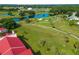 Aerial view of green golf course with pond at 760 Village Cir # 212, Venice, FL 34292