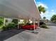 Covered carport parking with plenty of space at 760 Village Cir # 212, Venice, FL 34292
