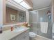 Bathroom with vanity, shower, and large mirror at 760 Village Cir # 212, Venice, FL 34292