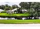 Backyard view of home with lush landscaping at 214 Wexford Pl # 150, Venice, FL 34293