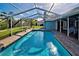 Enjoy this large, screened pool with ample deck space and covered patio at 856 Morgan Towne Pl, Venice, FL 34292