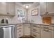 Modern kitchen featuring corner sink, stainless steel appliances, and ample cabinetry at 404 Cardiff Rd, Venice, FL 34293