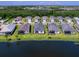 Aerial view of homes and community lake at 18260 Vizcaya Ct, Venice, FL 34293