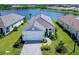 Aerial view of house and surrounding lake at 18260 Vizcaya Ct, Venice, FL 34293