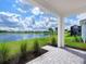 Covered patio overlooking a peaceful lake at 18260 Vizcaya Ct, Venice, FL 34293