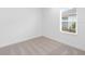 Bright bedroom with neutral carpeting and window at 18260 Vizcaya Ct, Venice, FL 34293