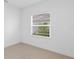 Empty spare bedroom with window and neutral walls at 18260 Vizcaya Ct, Venice, FL 34293
