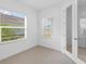 Small office space with two windows and a door at 18260 Vizcaya Ct, Venice, FL 34293