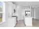 Modern kitchen with white cabinets and stainless steel appliances at 18260 Vizcaya Ct, Venice, FL 34293
