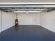 Attached garage with epoxy floor and water heater at 18260 Vizcaya Ct, Venice, FL 34293